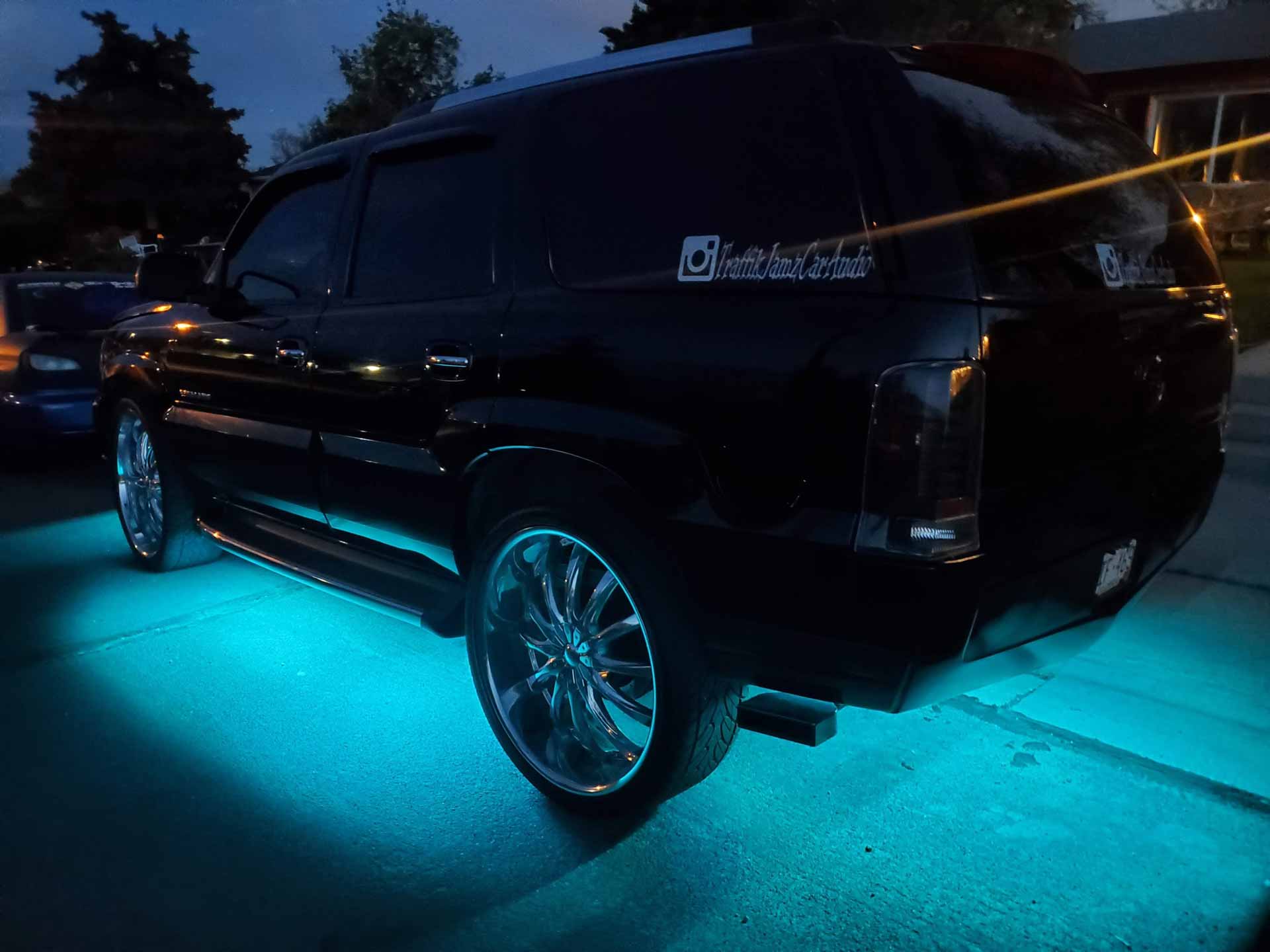 Black SUV with blue LED underlighting